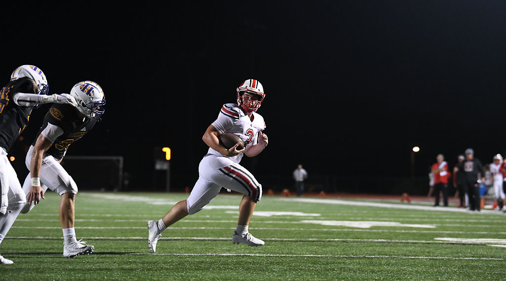 Jefferson City quarterback Cole Gresham runs